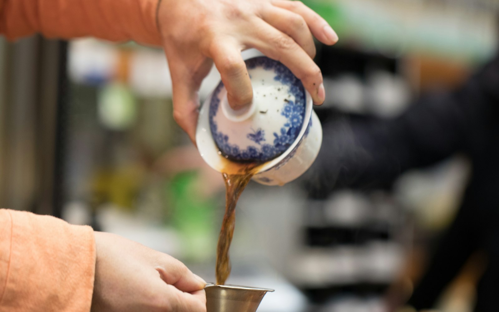 Pouring a pot of loose-leaf tea during afternoon tea in Harrogate