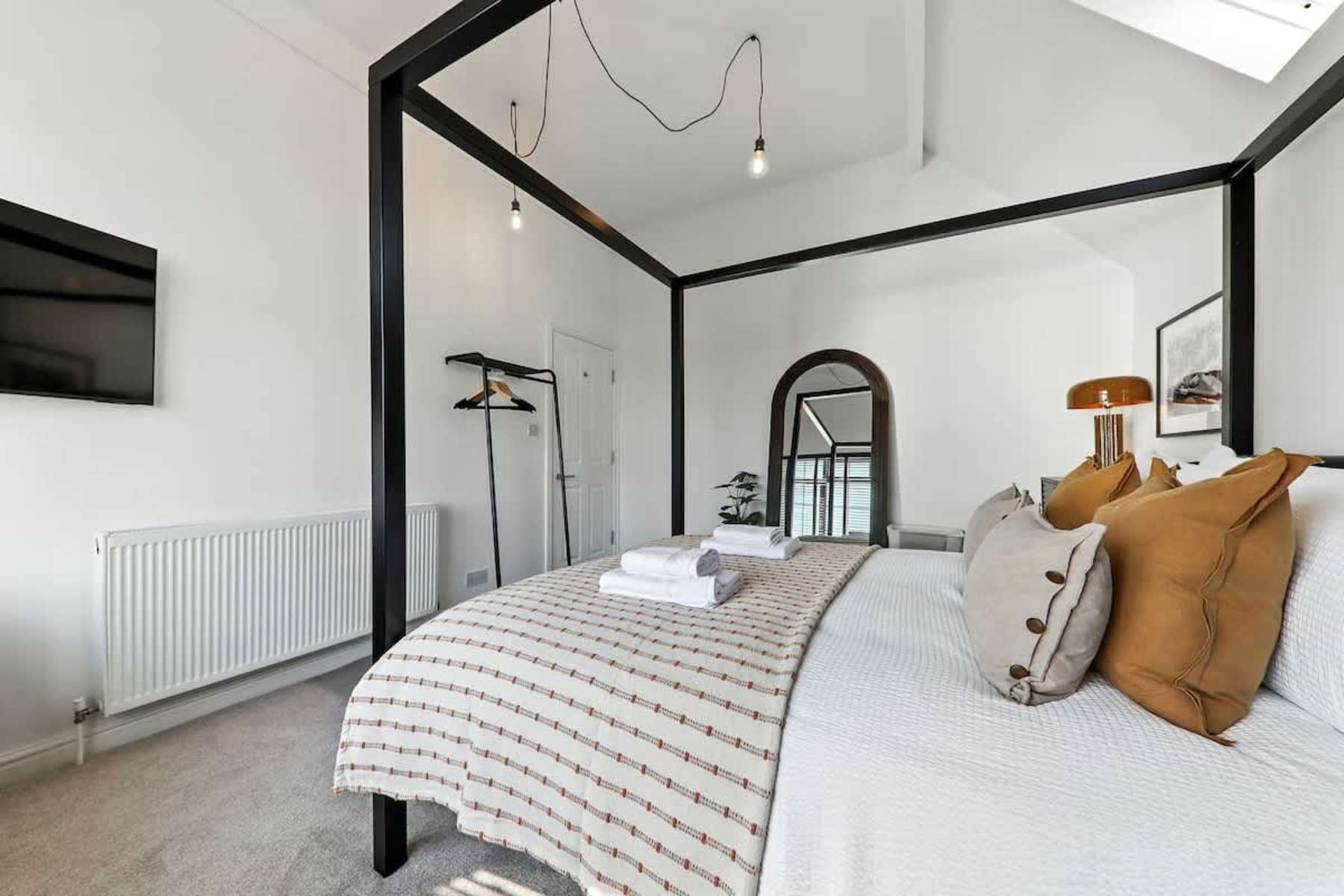 Four-poster bedroom at The Chatsworth Loft, Harrogate