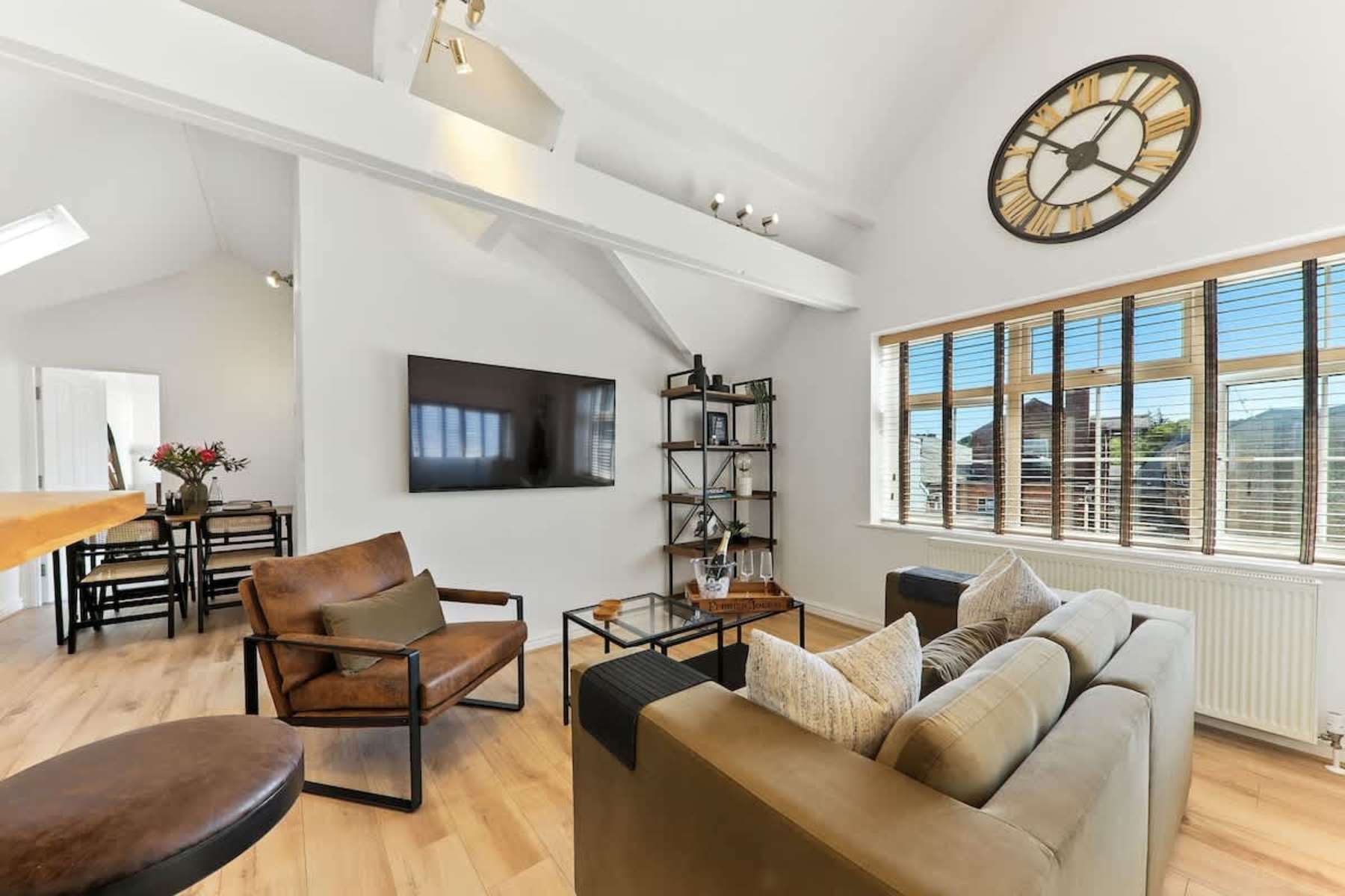 Open-plan living room with high ceilings at The Chatsworth Loft, Harrogate